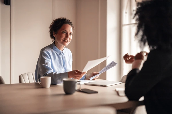 businesswoman engaging professional discussion colleague 600nw 2711982899